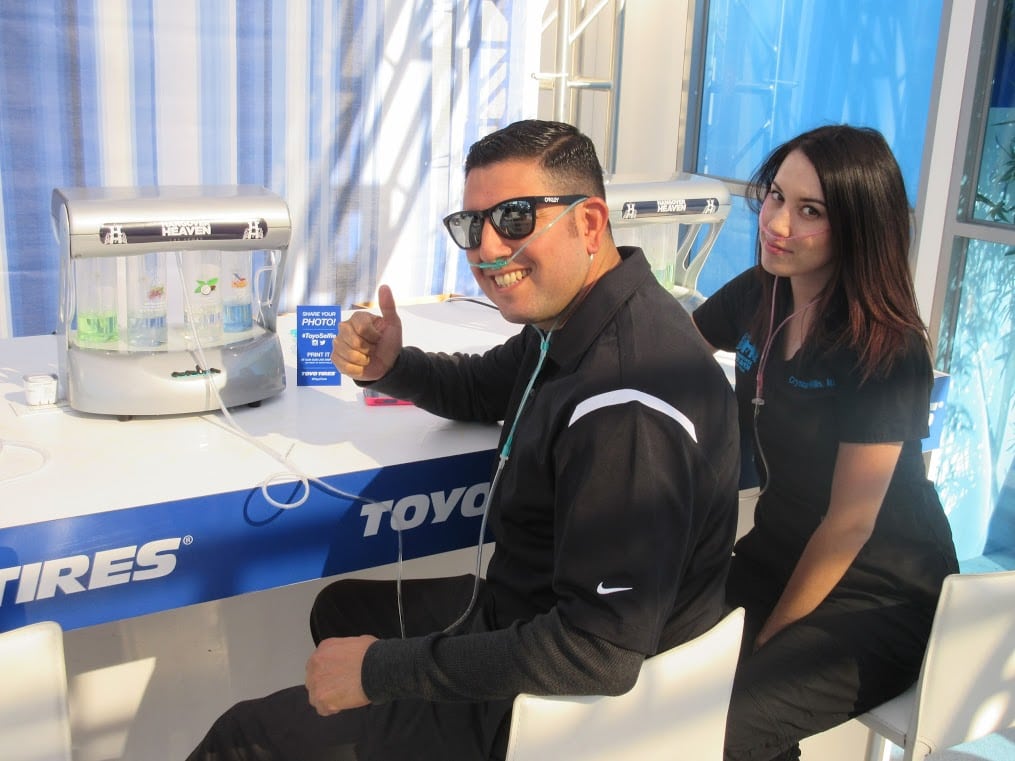 Two people partake in an oxygen bar provided by Hangover Heaven